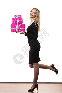 高雅的金发女孩拿着一堆粉红礼物盒白色的粉红礼物盒图片