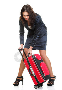 全年轻商业女青晚拉着白色背景孤立的红旅行袋时钟图片