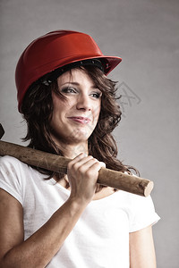 男女平等和权主义孩拿锤子工具有吸引力的建筑工人妇女图片