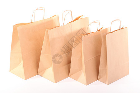 白色背景孤立的棕购物回收礼品袋图片