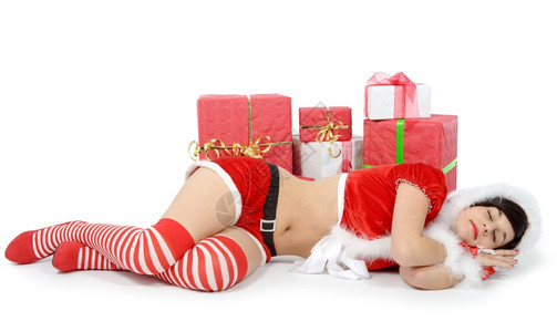 打扮成圣诞老人的漂亮感母亲躺在地板上图片