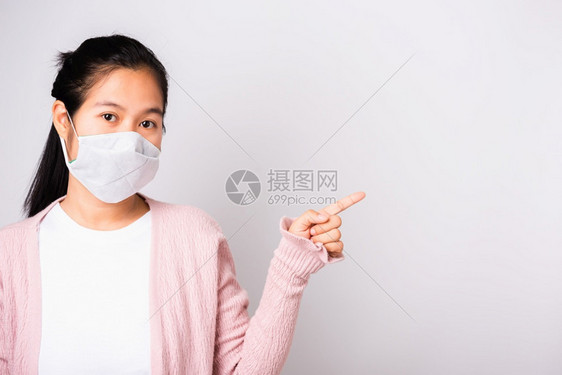 身穿外科保护的亚洲美丽女面对冠状身穿防科罗纳的面罩卫生图片