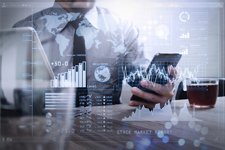 投资人分析股票市场报告和与商业情有关的金融信息仪表板并配有关键业绩指标KPI利用智能电话数字平板脑对接智能键盘和咖啡杯成功的商人图片