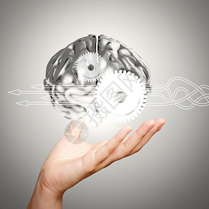 商业手将3D金属人脑作为概念图片