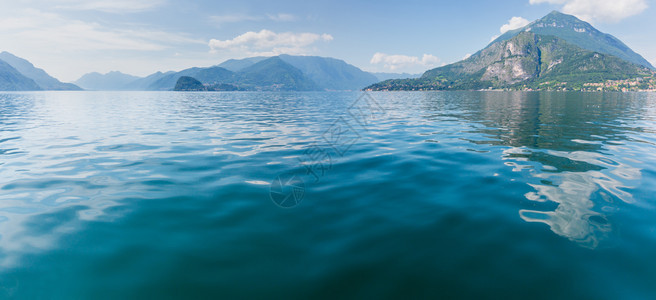 科莫湖意大利夏季海岸船头的风景暗淡全背景图片