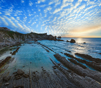 ArniaBeach西班牙大洋海岸线日落来自岩石图片