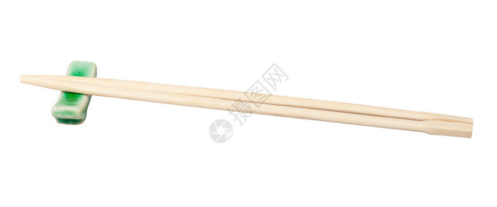 在白背景中隔绝的筷子休息用一次木筷子的侧面视图图片
