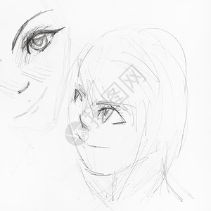 白纸上黑铅笔手工绘制的动画风格女孩脸部草图背景图片