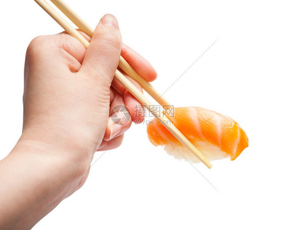 雌手用木筷子握着白底鲑鱼与隔绝图片