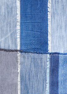 纺织品背景各种蓝色的denim扇形的散装件关闭各种蓝色扇形的散装件关闭图片
