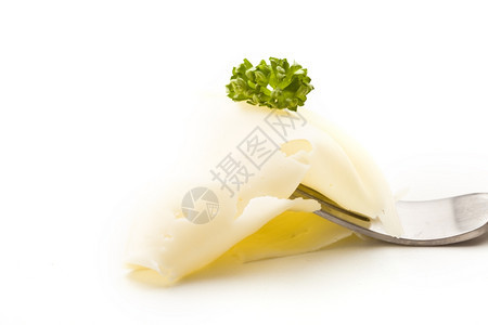 柔软的叉子配薄奶酪和欧芹照片产品面纱图片
