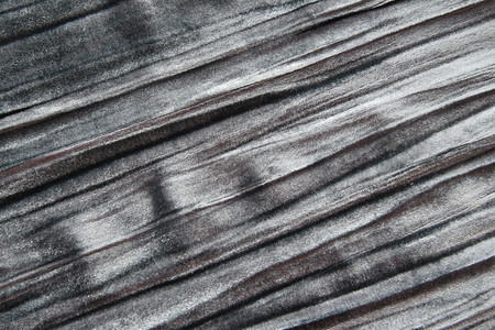 打褶的人造纹理和背景是灰色天鹅绒面织物灰色的图片