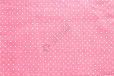 白色的温和粉含有小白波尔卡点的粉色棉织物纹理和背景图片