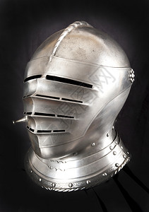 装饰品中世纪骑士的铁头盔非常重的甲文化背景图片