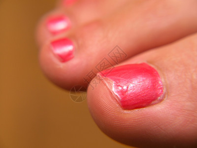 粉红色指甲涂漆脚上指甲的缝合画粉色身体图片