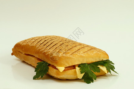 小吃香菜一顿饭配火腿奶酪和面食的灰色三明治图片