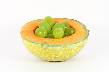 在一片瓜洞中的葡萄孤立在白色的甜瓜农业生素食主义者图片