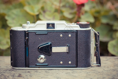 电影用模拟胶片制作的古老照相机美丽设计镜片照背景图片