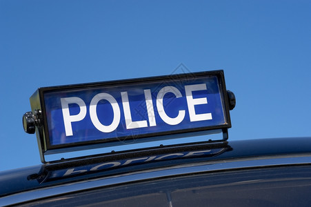 警车1950年西雅图的一辆古老英国警车屋顶牌的警长汽车背景