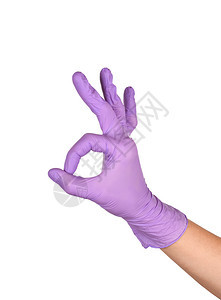 橡胶一种家政在白色背景下显示手印牌用紫色乳胶手套在白女手势或白色上孤立的标志隔开图片