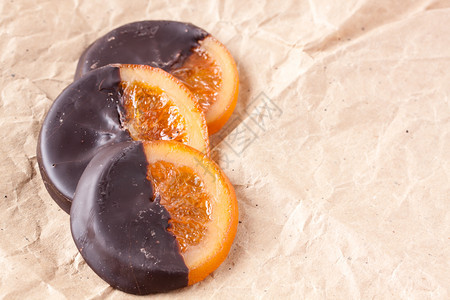 小吃橙片糖有覆盖的花黑暗甜点图片