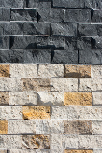 岩石垃圾摇滚装饰立方石墙作为背景纹理砖砌背景图片