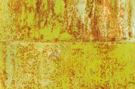 关闭生锈的粗绿色油漆金属表面质地棕色的垃圾摇滚图片