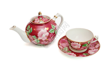 碟子茶壶与世隔绝的老式花粉茶服务红色的图片