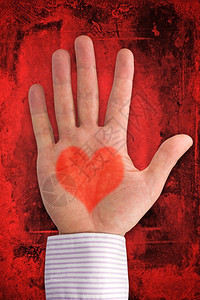 按摩浪漫象征深红背景的心型爱之手以深红背景为心脏形状图片