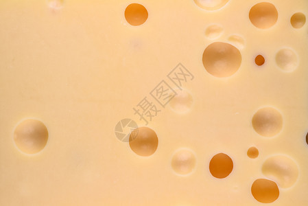 烹饪黄奶酪的贴近纹理有大洞的黄起司食物背景奶酪有大洞的切达干酪堵塞图片