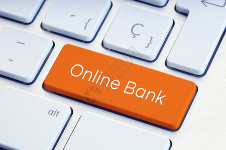 数字的银行业橙色键盘上的在线银行技术图片