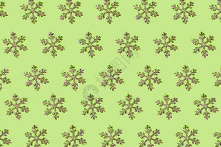 在绿色背景模式下重复的雪花冬天新抽象图片