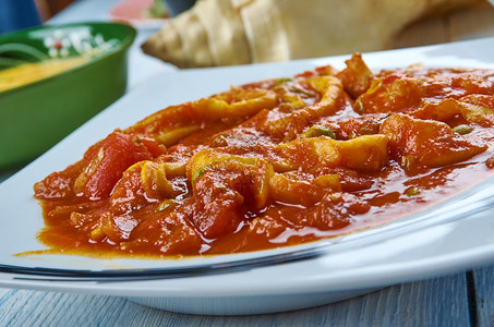 椰子350酱食物kohonthalkulambu烤椰子肉汁中的鱿鱼煮熟了喀拉风格