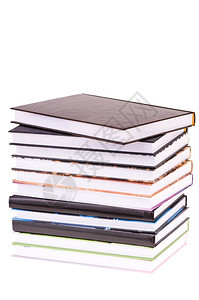 组织者白色背景上孤立的堆叠书精装笔记本图片