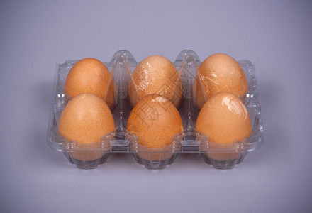 灰色本底塑料包装中的几内亚禽鸡蛋伟大的格里戈拉瓦早餐图片