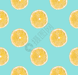 新鲜的食物黄柠檬新片无缝模式关闭柑橘水果切片在面食蓝背景上摄影室背景新鲜黄色柠檬切片没有缝合模式关闭工作室摄影成熟图片