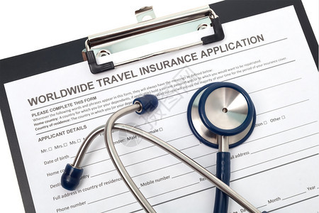 旅游关心健康国际旅行医疗保险申请配有听诊器的国际旅行医疗保险申请背景图片