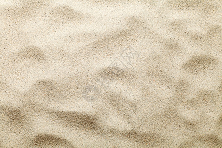 黄色的旅行沙纸纹理海滩背景顶视场质地背景图片