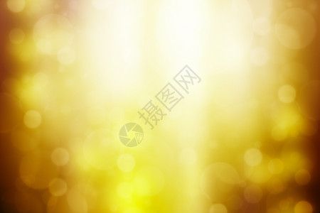 优雅的圣诞节带有bokeh和太阳光的金色抽象背景光线图片