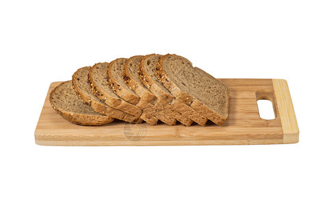 白色的烘烤切片面包在纸板上孤立在白谷物面包上在切纸板一种图片
