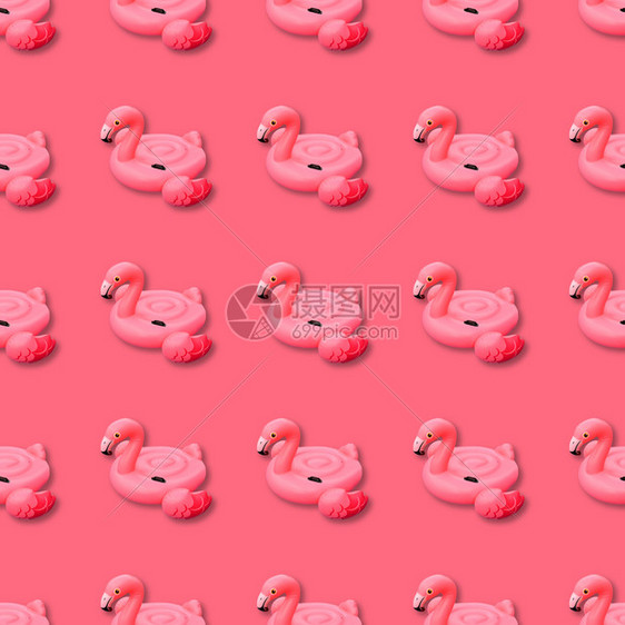 无缝的躺粉红色火烈鸟无缝模式的游泳池玩具粉色背景Flammingo充气式喷雾粉红本底图案色火烈鸟无缝模式Flamingo充气式胶图片