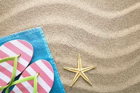 海滩沙纸背景有毛巾翻转拖网和海星动滨图片