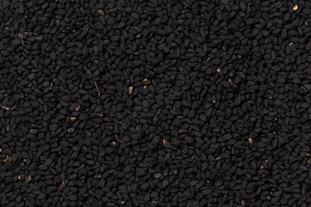 向阳而生逆风翻盘芝麻黑种子为背景而关闭药物调味品蔬菜背景