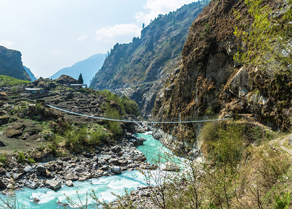 一座跨越山河的桥在尼泊尔春天桑日亚洲谷户外图片