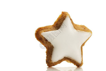 可口蛋糕一颗恒星形状的肉桂饼干一颗恒星形状的白底肉桂饼干香气图片