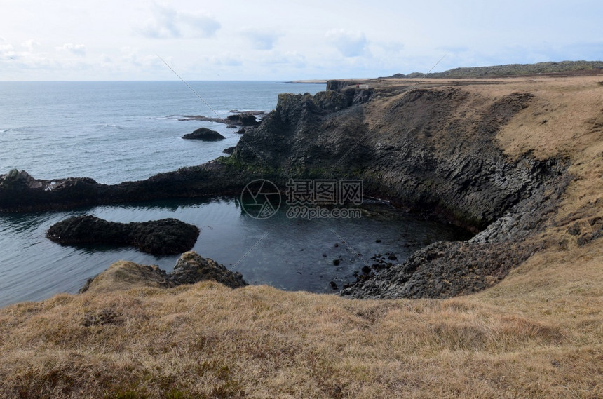 冰岛的半草黑岩层和冰海岸的景色观光风图片