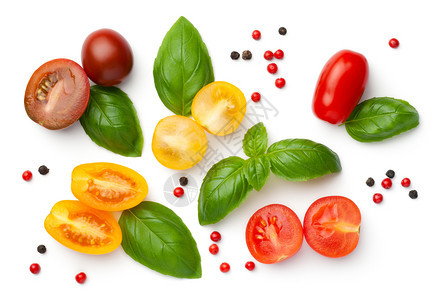 红色的素食主义者生红色黄和棕红番茄有新鲜的鱼和胡椒花面白色背景上孤立的樱桃西红柿成分图片
