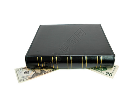 专辑美元精装厚黑色的书有金修饰将20块钱的钞票挤压下来图片