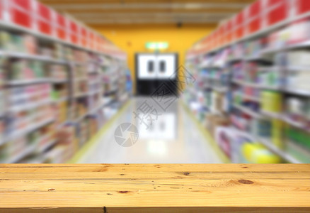 在超市背景中将产品放在模糊通道上的木头Wood超级市场商品大卖图片