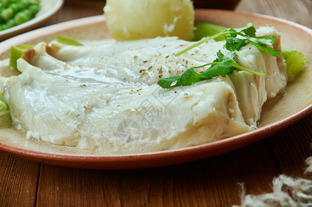 Lutefisk是一些北欧的传统菜盘挪威烹饪传统各种菜类顶端观诺斯克美食治疗图片